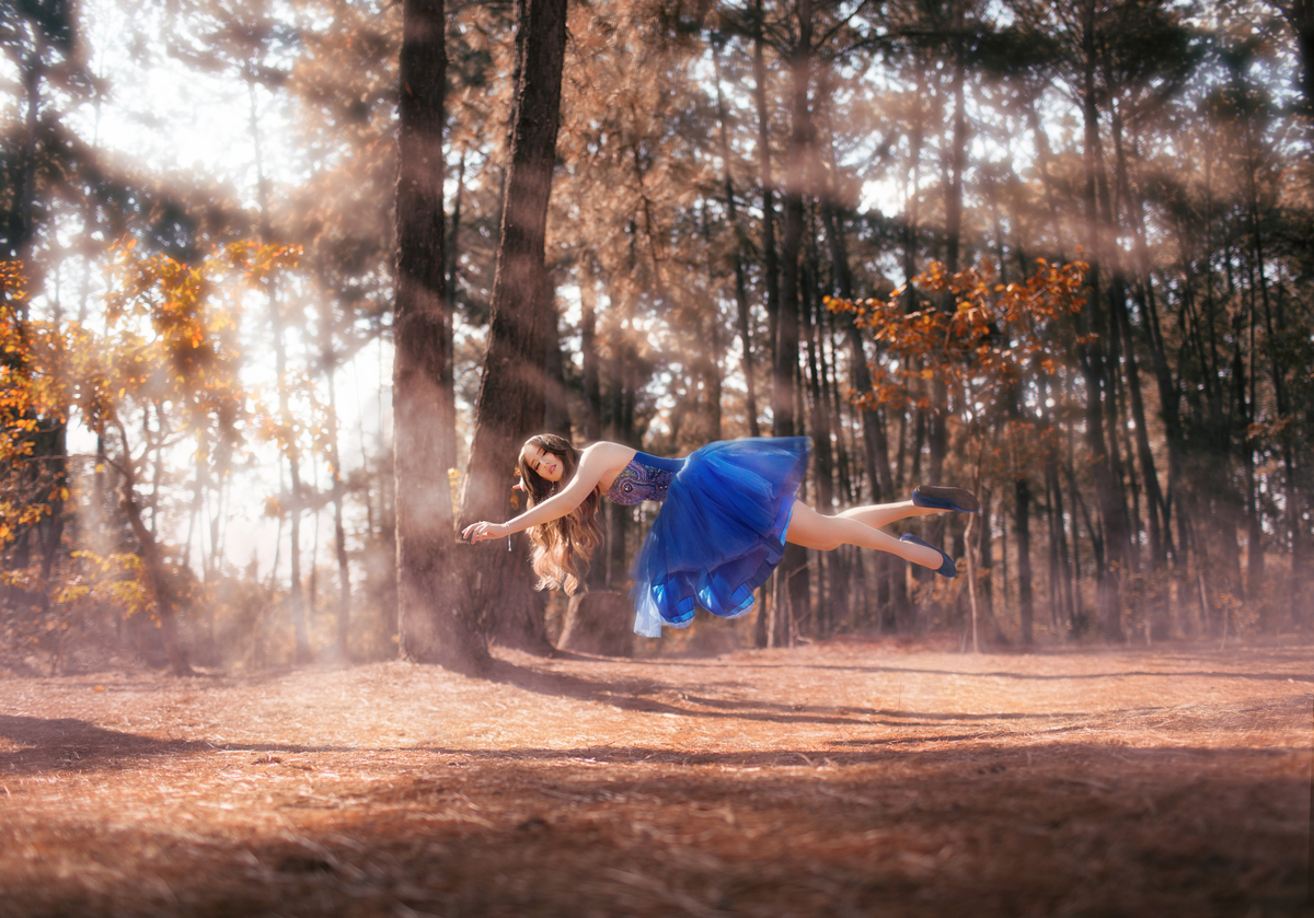 Debutante voando. Ensaio de debutante feito no Jardim Botânico de Brasília pelo fotógrafo Rafael Ohana