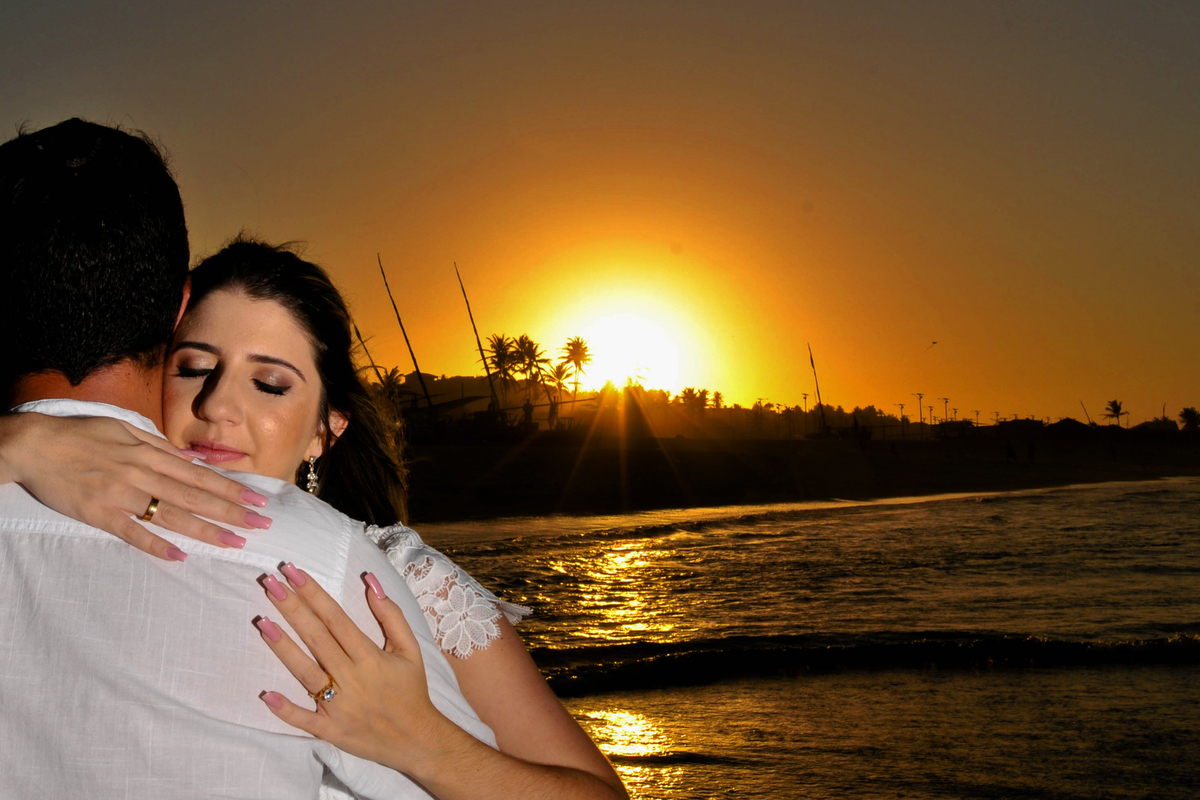 Fotografia de casal no por do sol