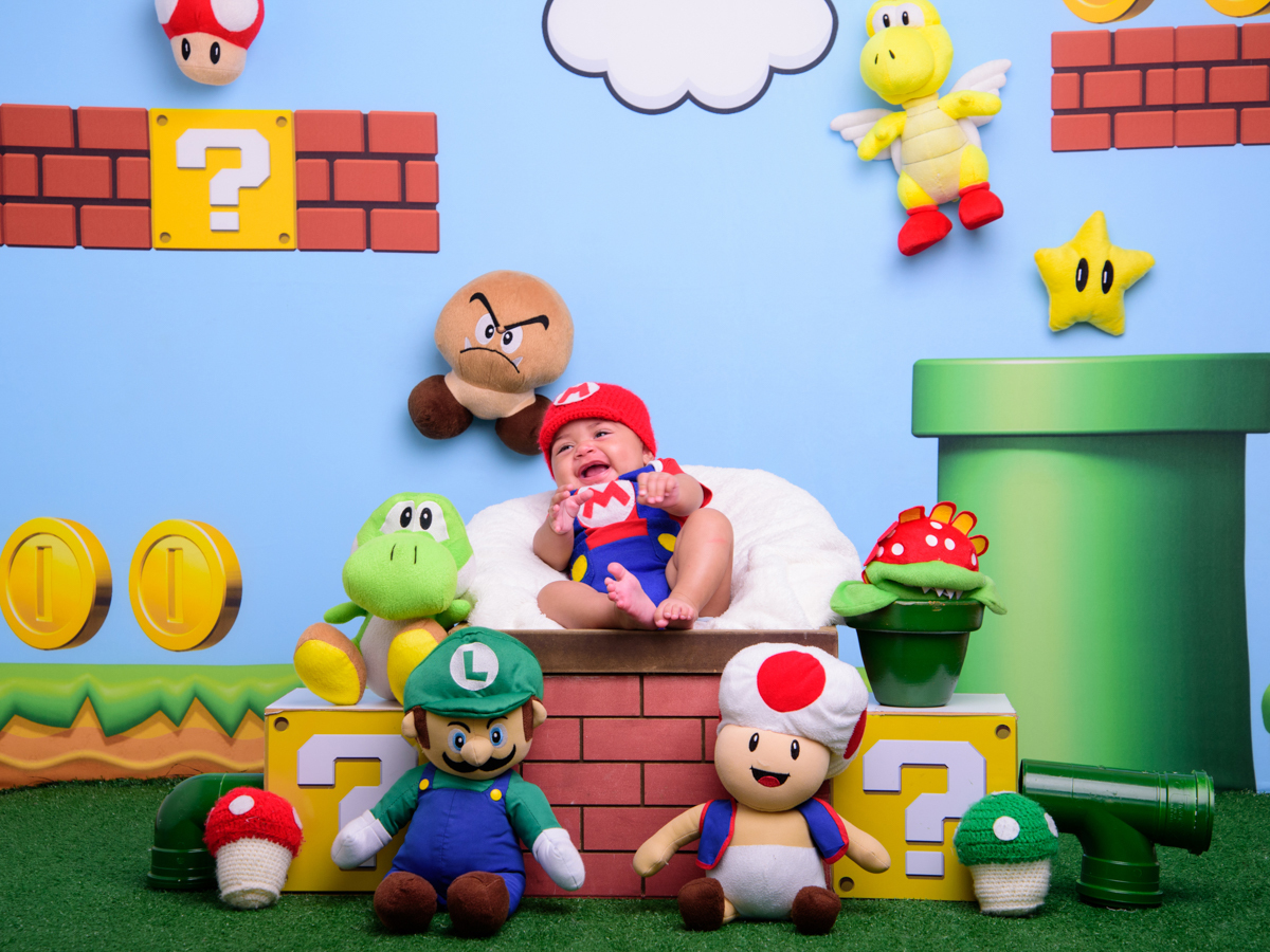 Sessão Dia dos Pais, estrela, Mário, Luigi, moedas, cogumelo, tartaruga, jacaré, paisagem, tijolos, túnel, gargalhada.