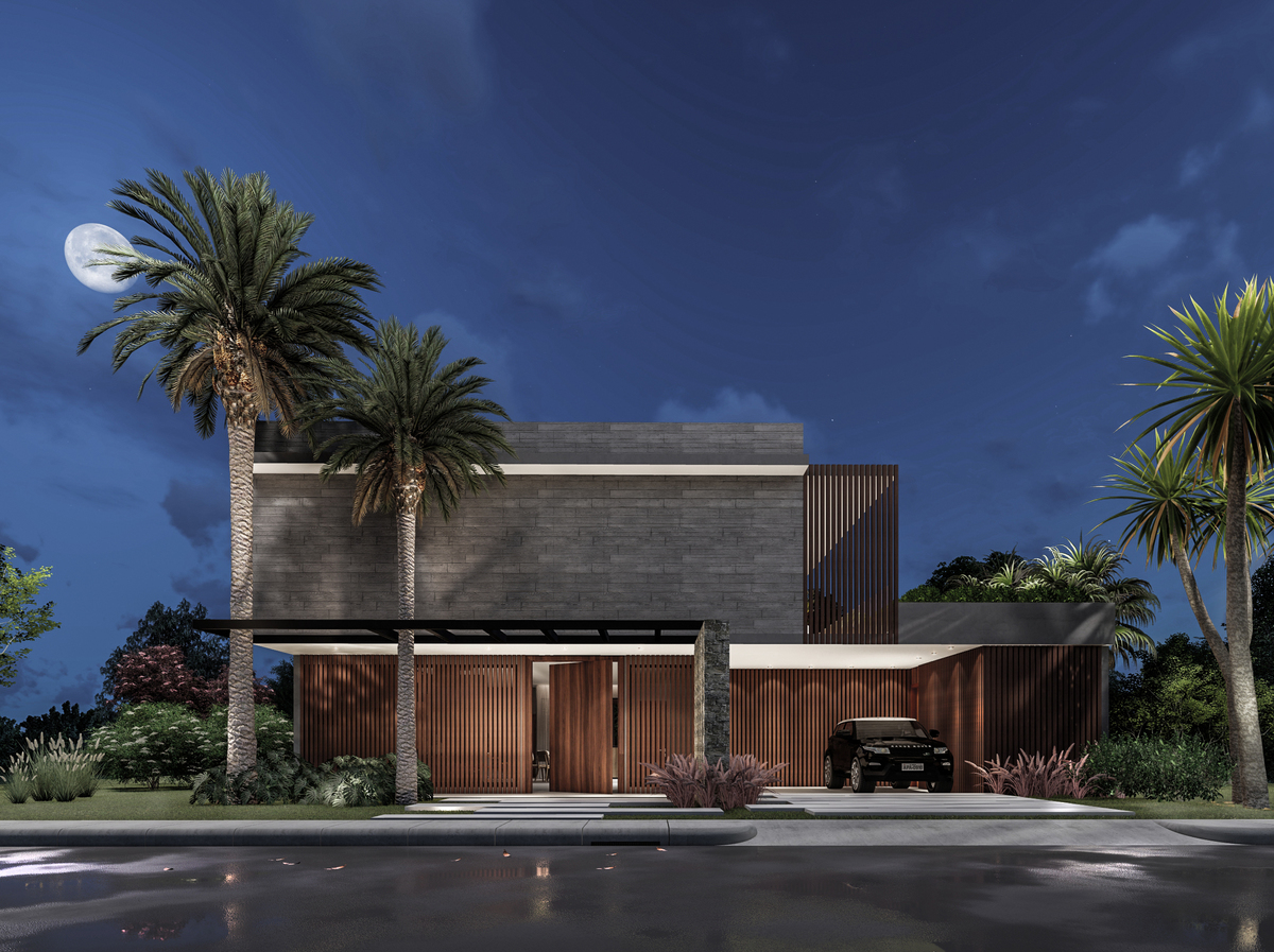 #ParaCegoVer: Foto Noturna da residência.
Céu com lua cheia e poucas nuvens, dois coqueiros  laterais na fachada.