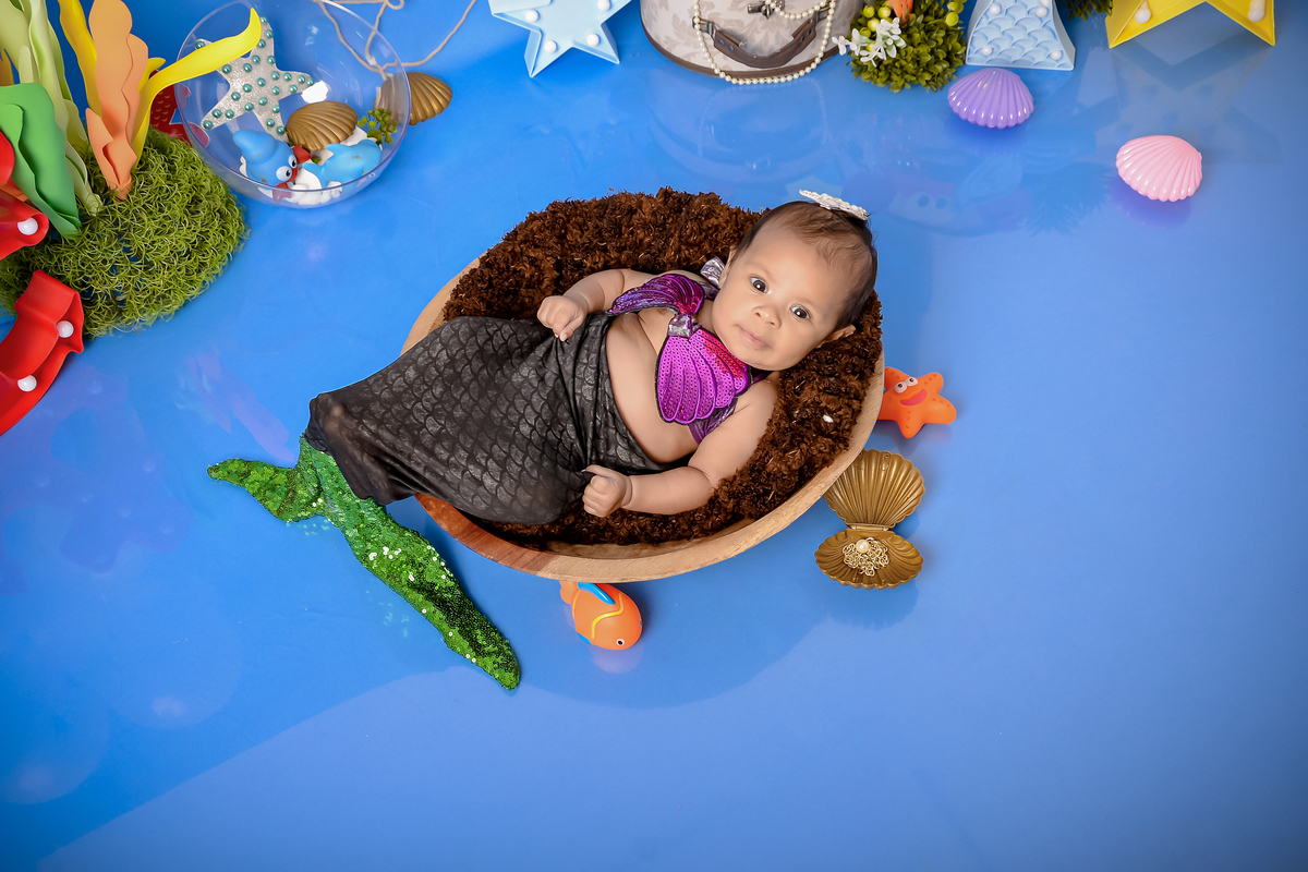 Drica Studio - Drica Studio fotografias - Drica Studio Xinguara Pará - acompanhamento mensal - fotos fundo do mar - bebe - azul - estrela - âncora - golfinho - sereia - peixes - perola - calda