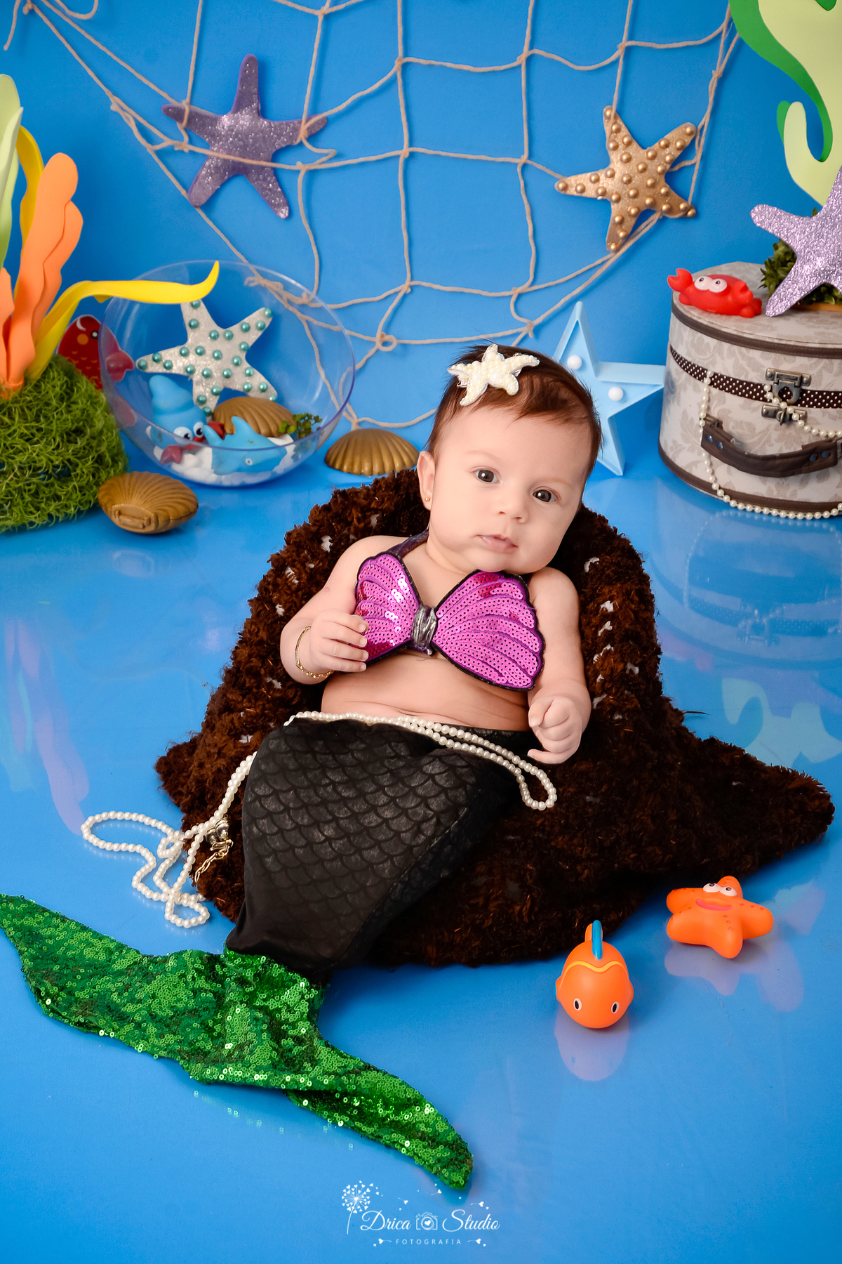 Drica Studio - Drica Studio fotografias - Drica Studio Xinguara Pará - acompanhamento mensal - fotos fundo do mar - bebe - azul - estrela - âncora - golfinho - sereia - peixes - perola 