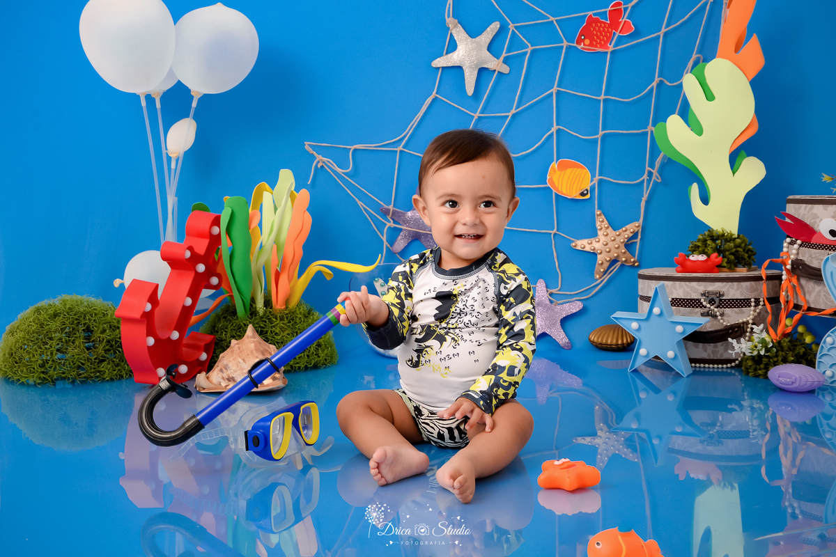 Drica Studio - Drica Studio fotografias - Drica Studio Xinguara Pará - acompanhamento mensal - fotos de bebe - cenário fundo do mar - azul - estrela do mar - âncora - cenário do mês - golfinho - mergulhador
