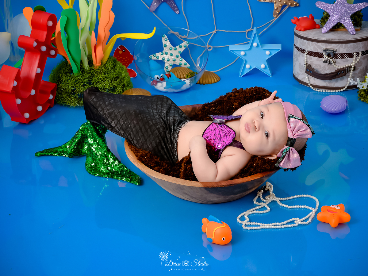 Drica Studio - Drica Studio fotografias - Drica Studio Xinguara Pará - acompanhamento mensal - fotos fundo do mar - bebe - azul - estrela - âncora - golfinho - sereia - peixes 