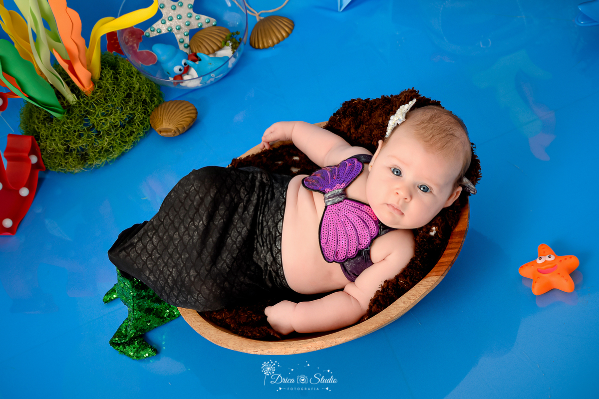 Drica Studio - Drica Studio fotografias - Drica Studio Xinguara Pará - acompanhamento mensal - fotos fundo do mar - bebe - azul - estrela - âncora - golfinho - sereia - peixes - perola 
