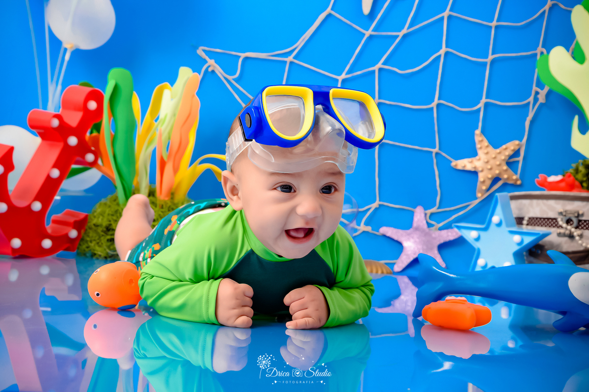 Drica Studio - Drica Studio fotografias - Drica Studio Xinguara Pará - acompanhamento mensal - fotos de bebe - cenário fundo do mar - azul - estrela do mar - âncora - cenário do mês - golfinho - mergulhador