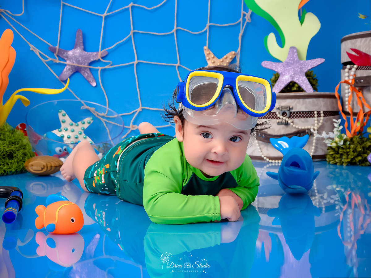 Drica Studio - Drica Studio fotografias - Drica Studio Xinguara Pará - acompanhamento mensal - fotos de bebe - cenário fundo do mar - azul - estrela do mar - âncora - cenário do mês - golfinho - mergulhador 