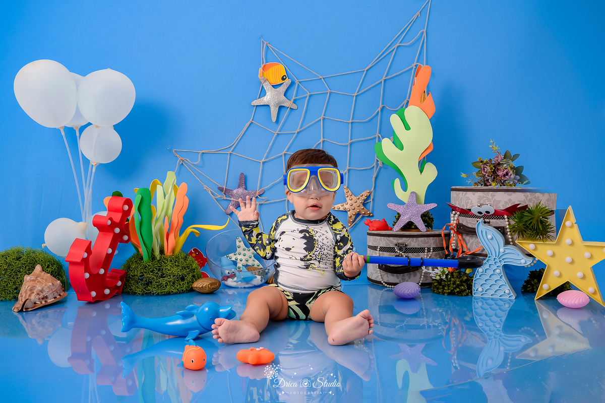 Drica Studio - Drica Studio fotografias - Drica Studio Xinguara Pará - acompanhamento mensal - fotos de bebe - cenário fundo do mar - azul - estrela do mar - âncora - cenário do mês - golfinho
