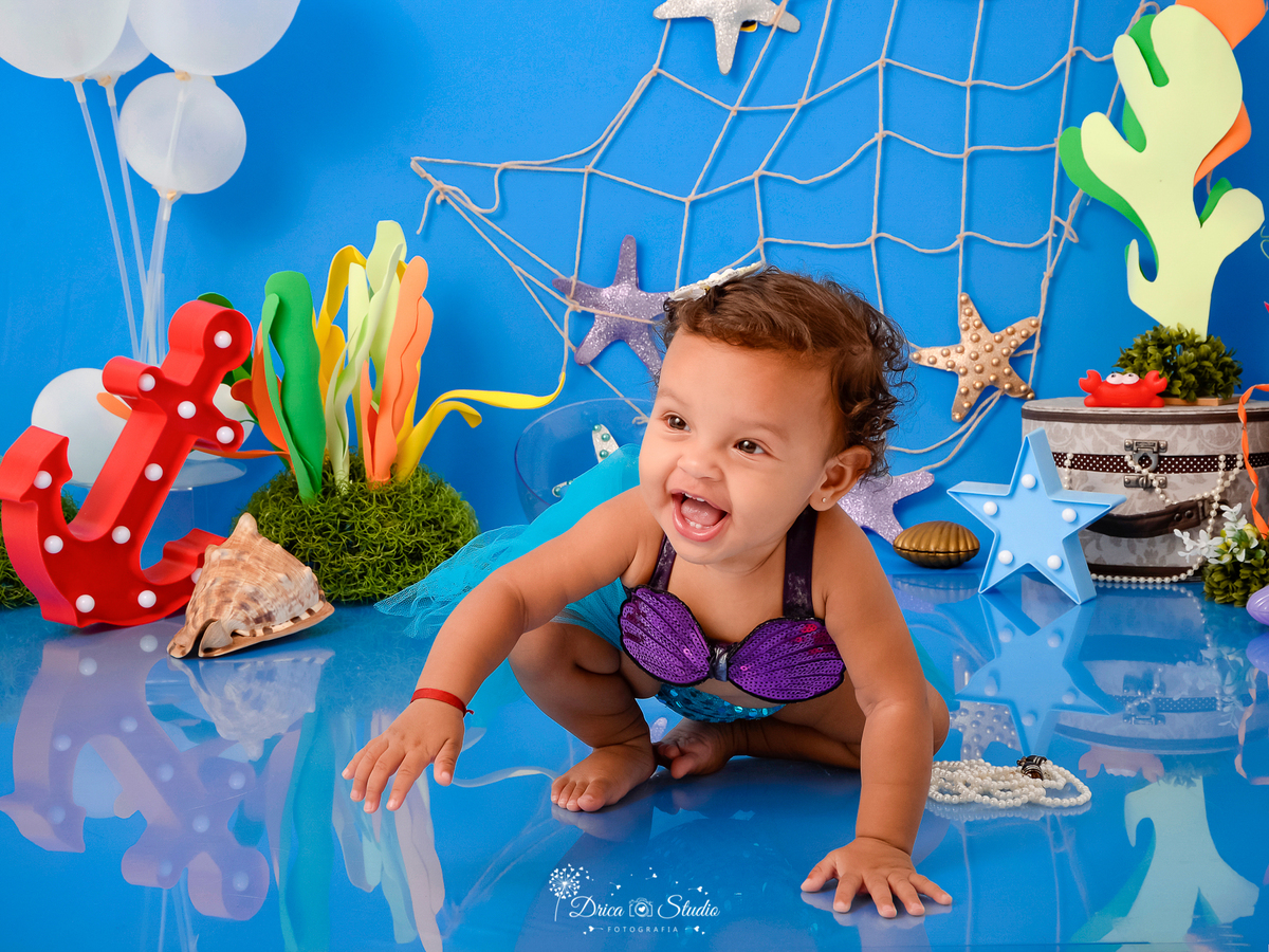 Drica Studio - Drica Studio fotografias - Drica Studio Xinguara Pará - acompanhamento mensal - fotos fundo do mar - bebe - azul - estrela - âncora - golfinho - sereia - peixes 