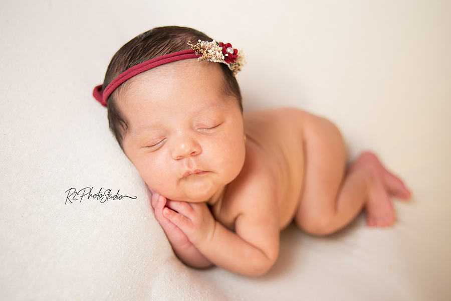 Foto de Bebe menina com headband vermelha