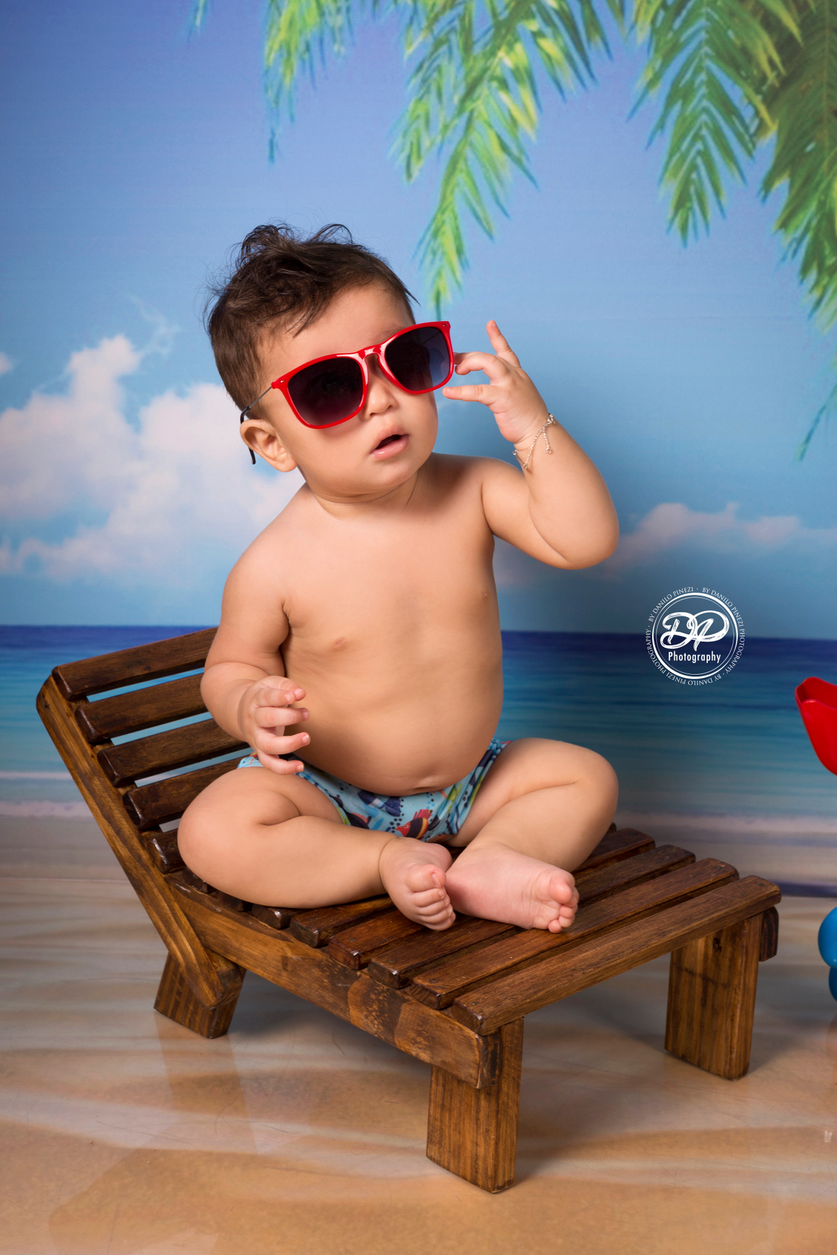 Ensaio Praia/verão de menino feitono estúdio Danilo Pinezi Fotografia em Bariri/SP