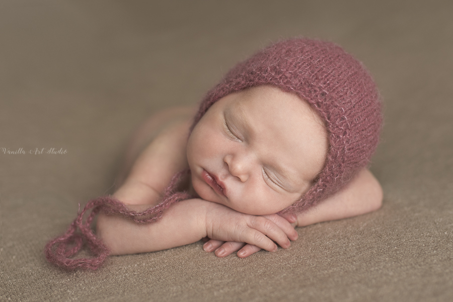 baby girl sleeping on chin 