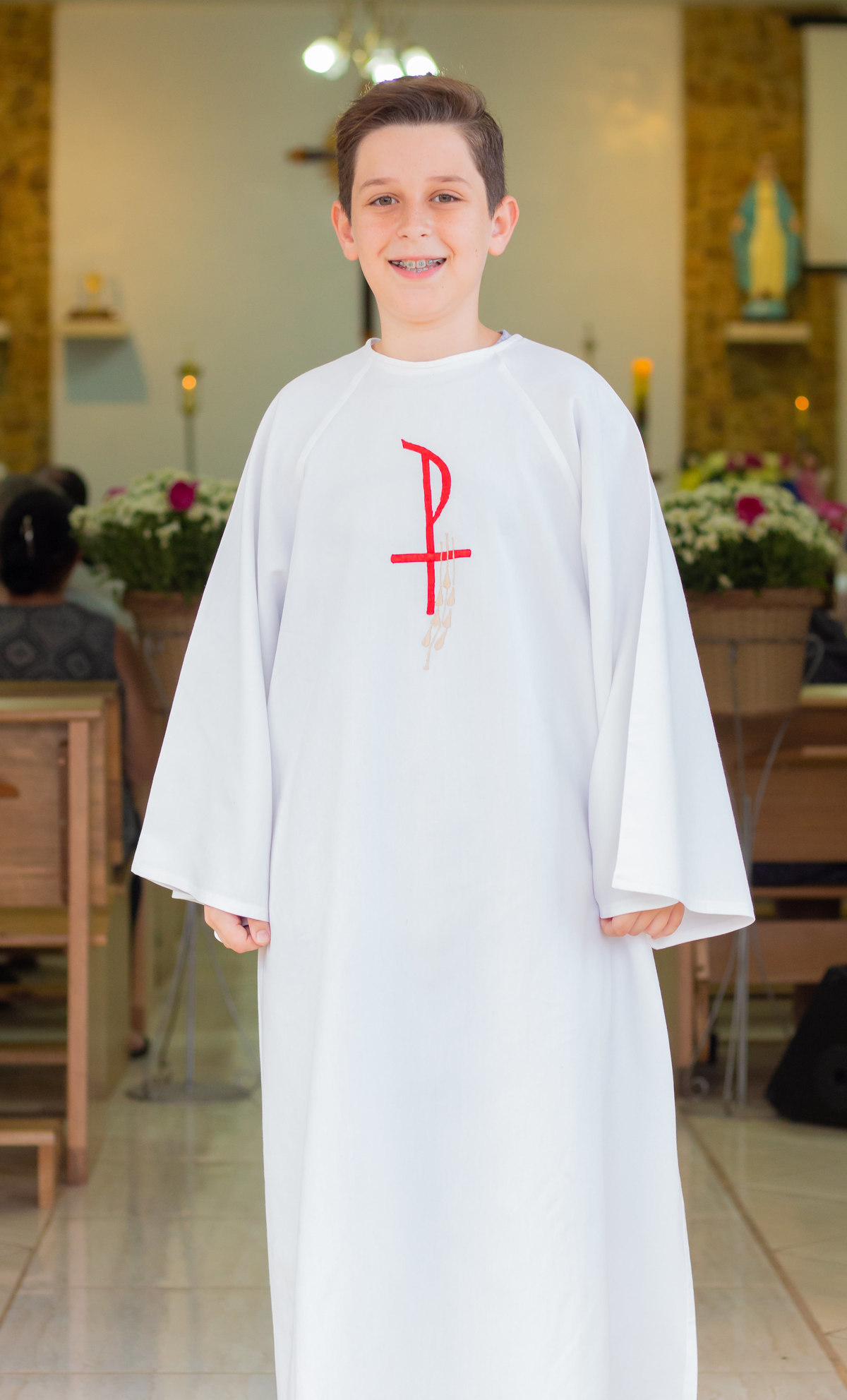 Capela Nossa Senhora das Graças Bauru, primeira eucaristia, menino sorrindo em sua primeira eucaristia