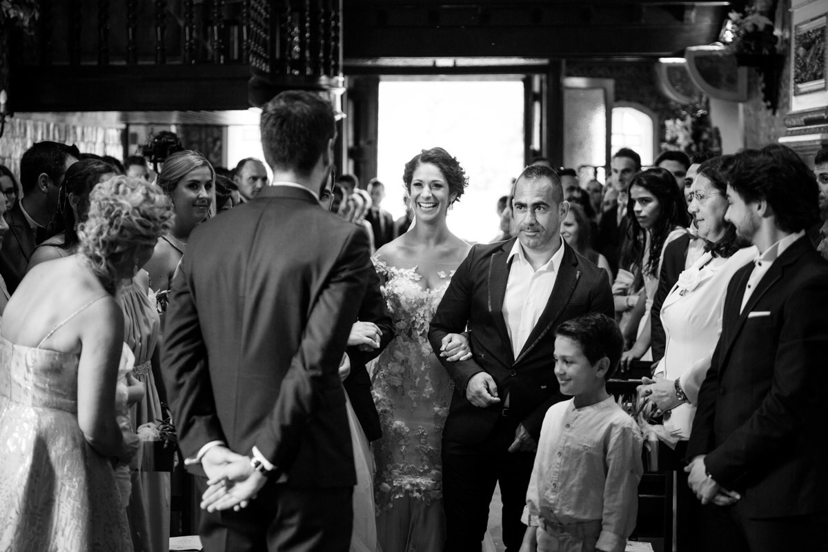 groom crying when the bride walks into the church