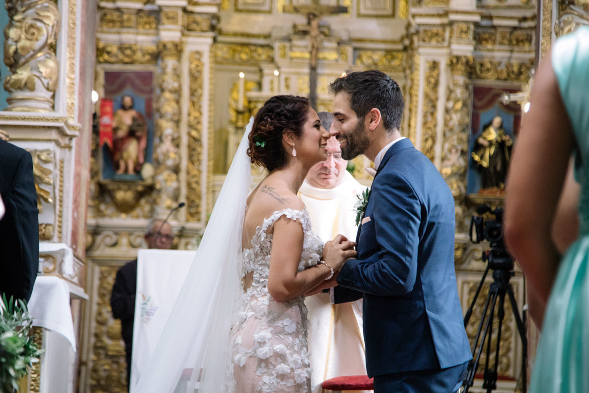 Bride and groom kissing after the wedding vows