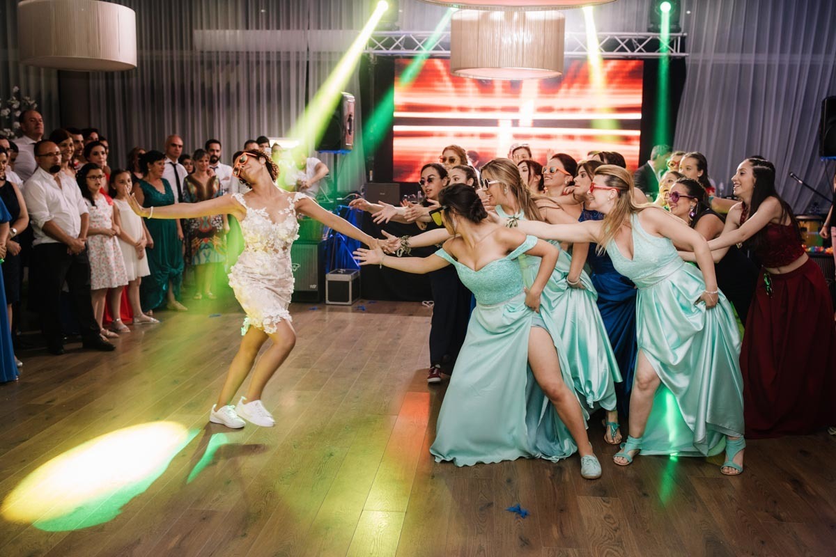 bride dancing with bridesmaids