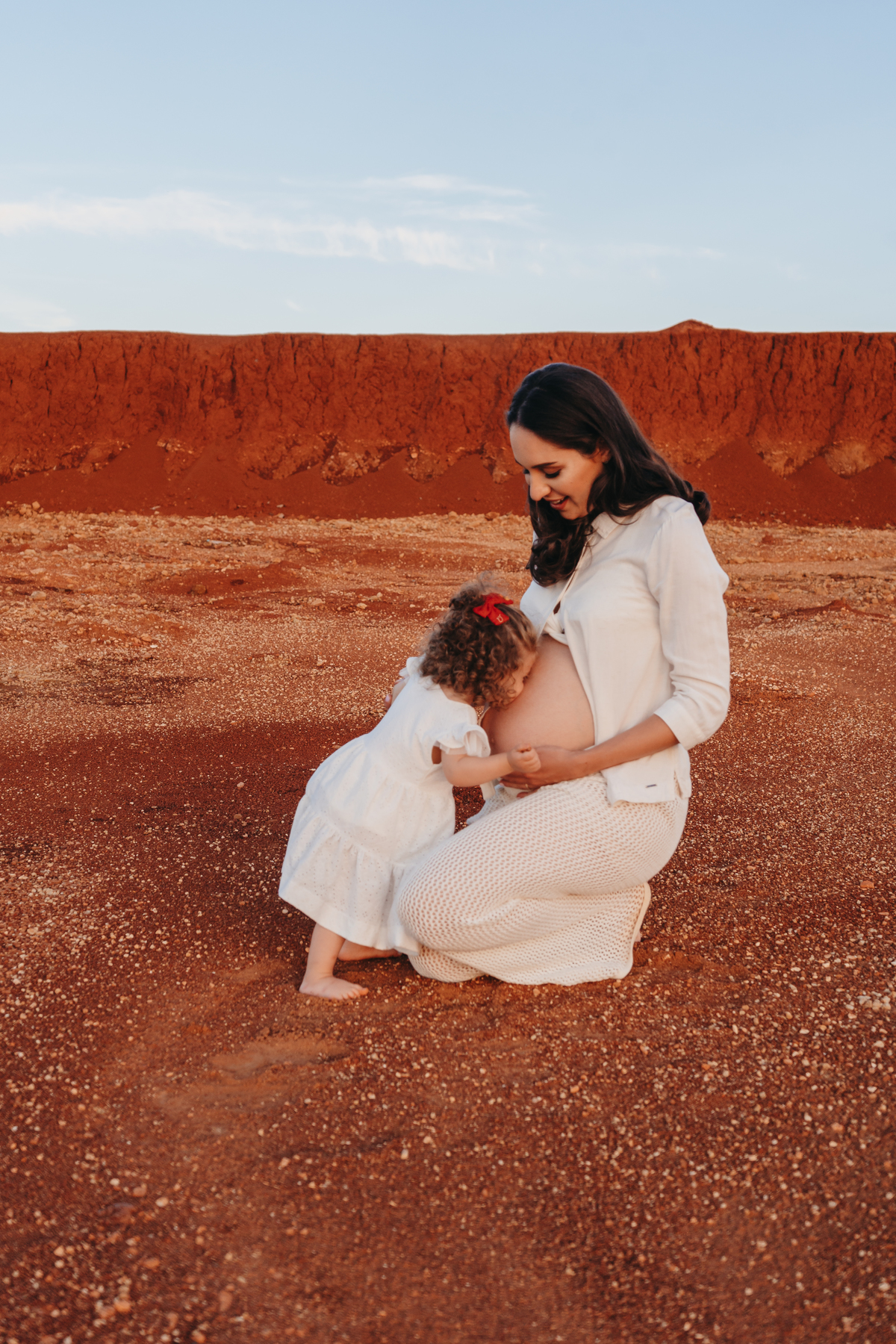 gestante na  terra final do dia