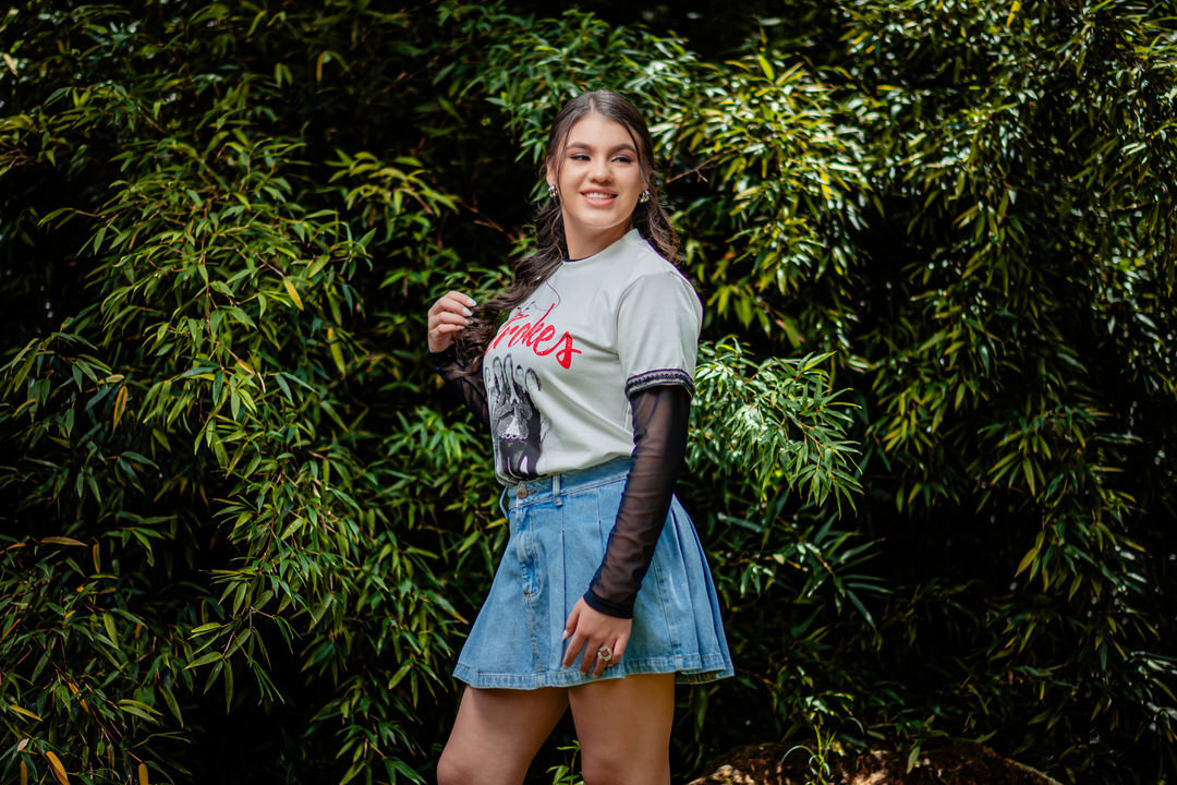 Elegant quinceañera portrait surrounded by the beautiful gardens of Museo El Castillo.